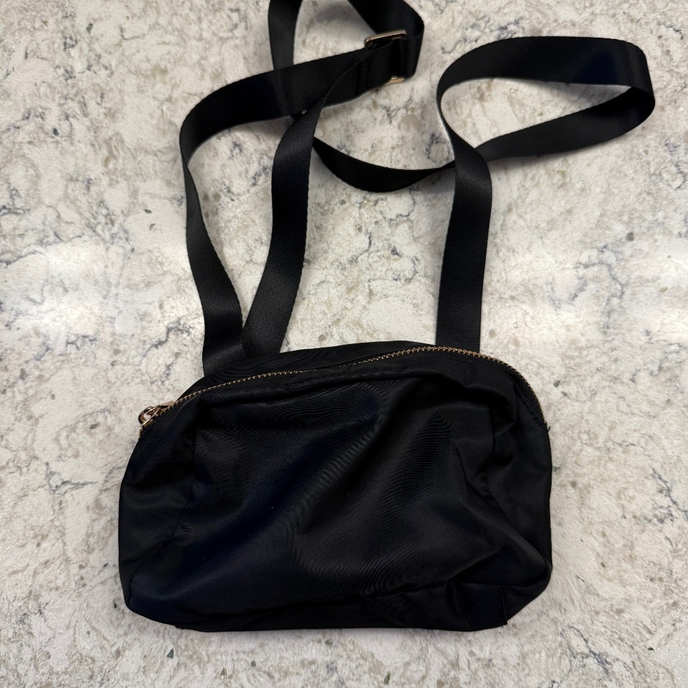 A new Day black crossbody‎ or bum handbag